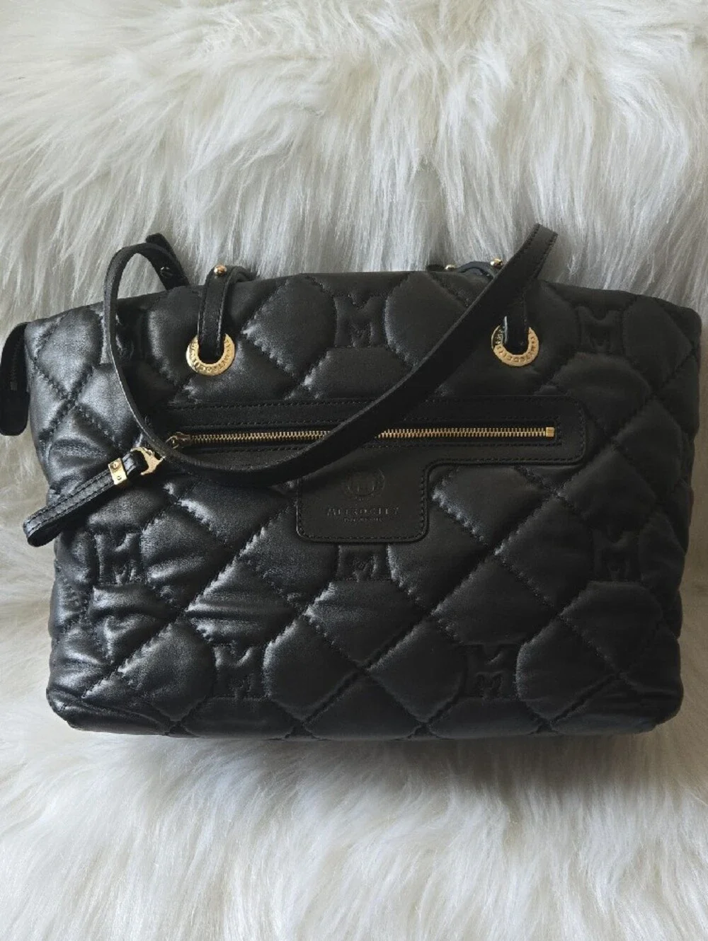 Quilted Black Tote with Gold Medallion Accent